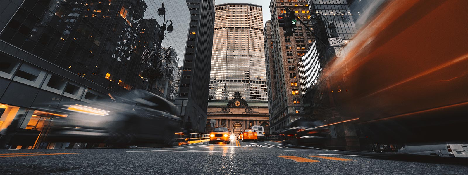 street, buildings and cars at high speed