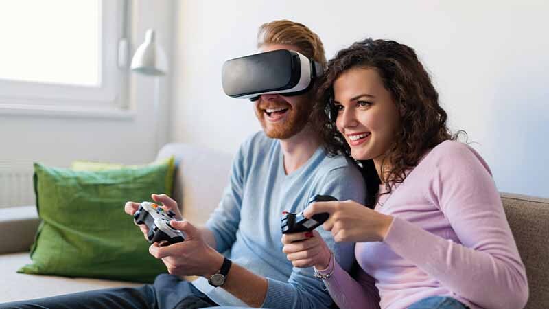 Couple playing virtual reality video games